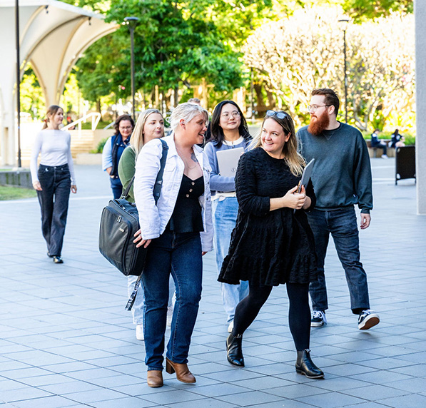 ACAP students A group of students outside, walking towards ACAP Brisbane campus