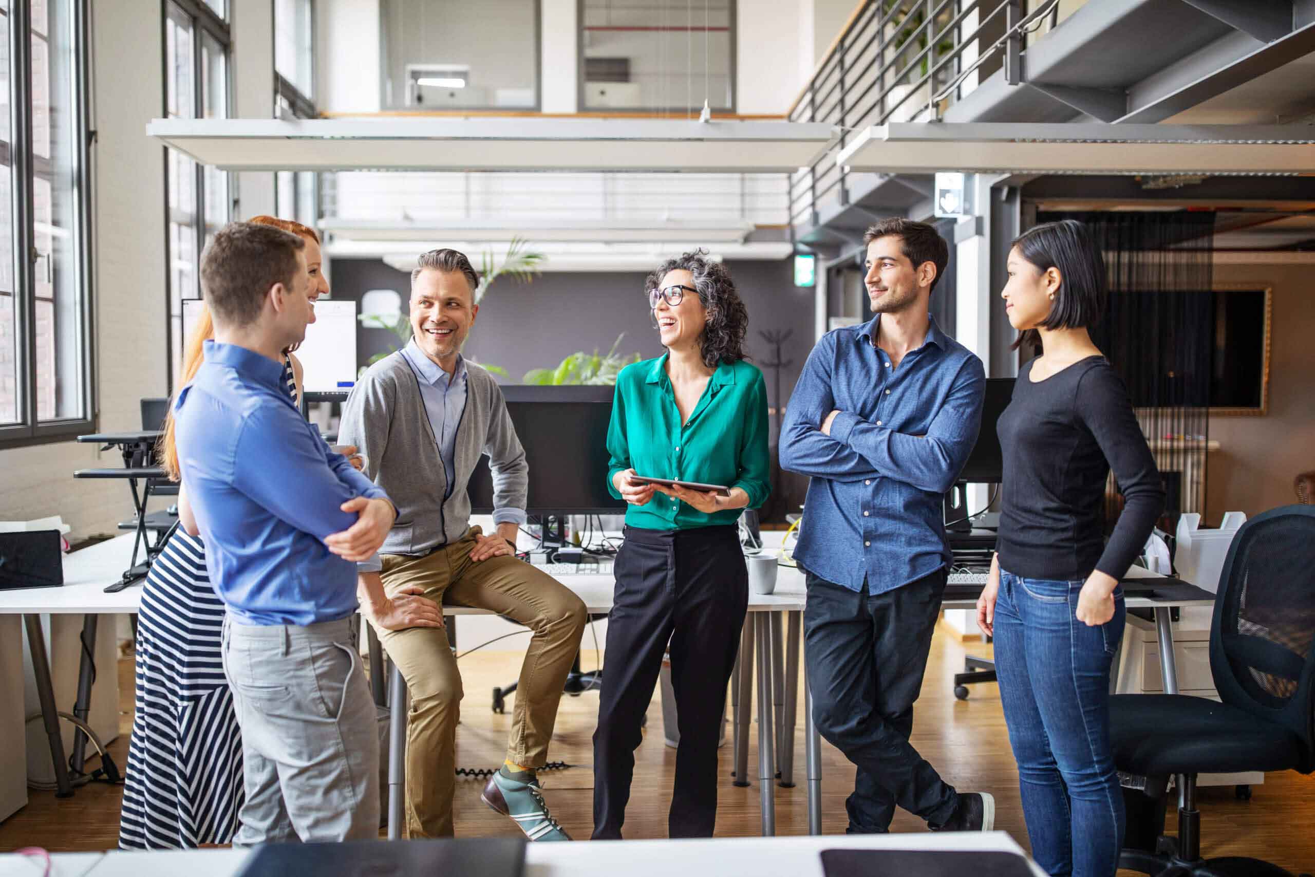 Six people discussing with each other