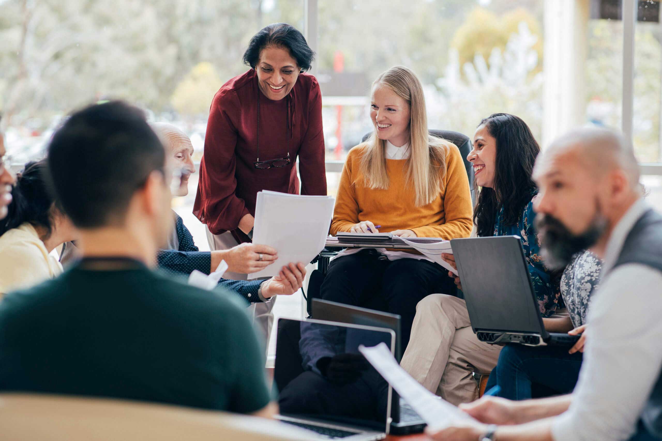 Group of students with laptops in circle Management-faculty