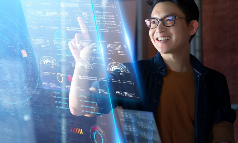 A man interacting with a virtual screen.