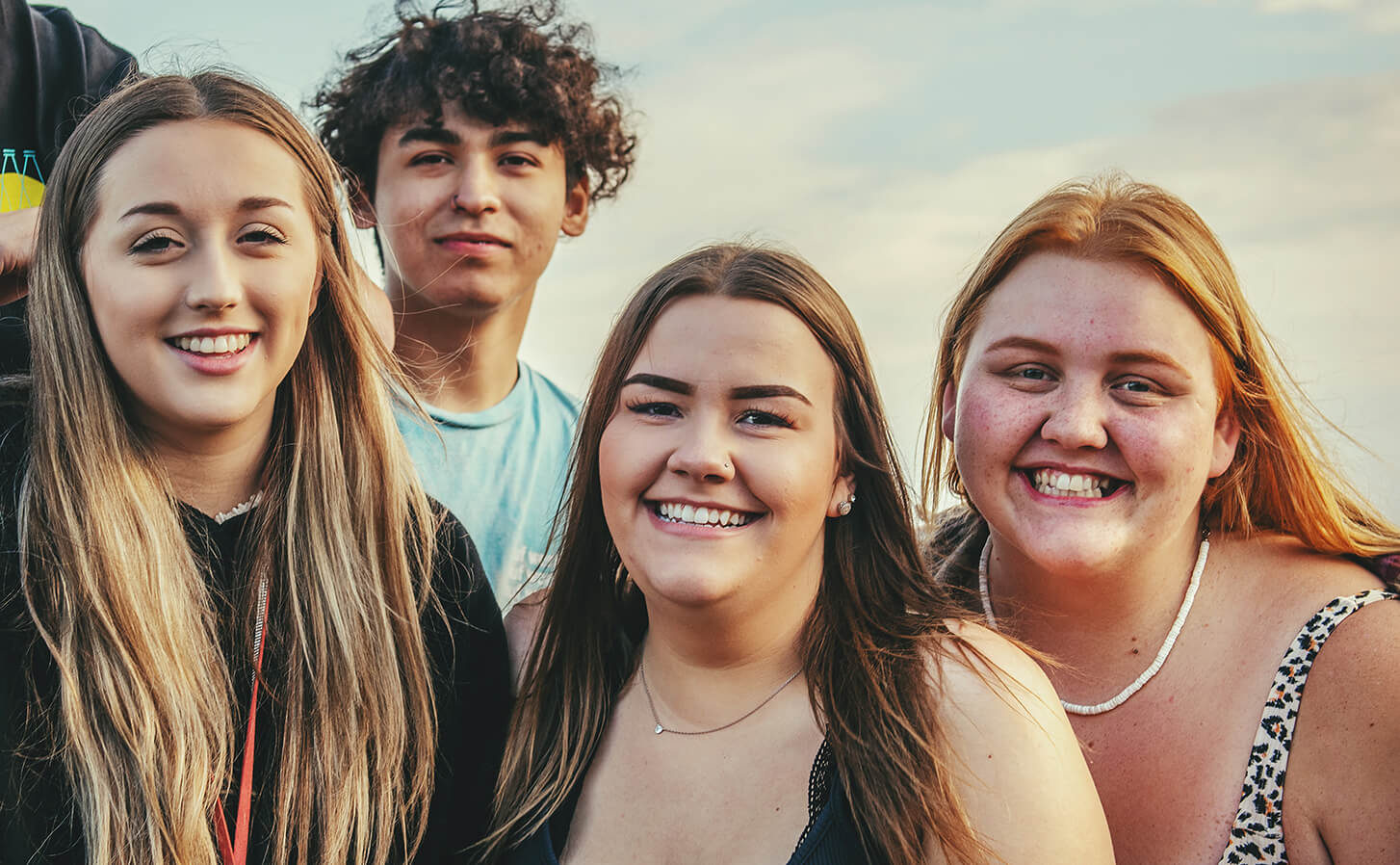 Three female, one male young students