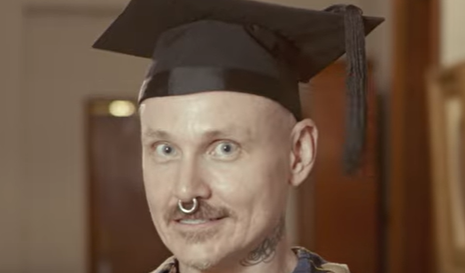 Anthony Student with graduation cap on