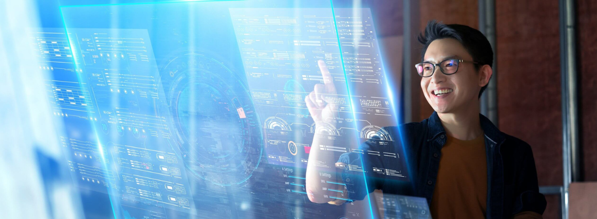 Master of Information Technology Student Figure Pointing At Screen An IT student pointing at a virtual screen