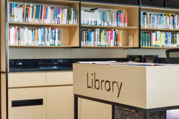 ACAP Library front desk and bookshelves