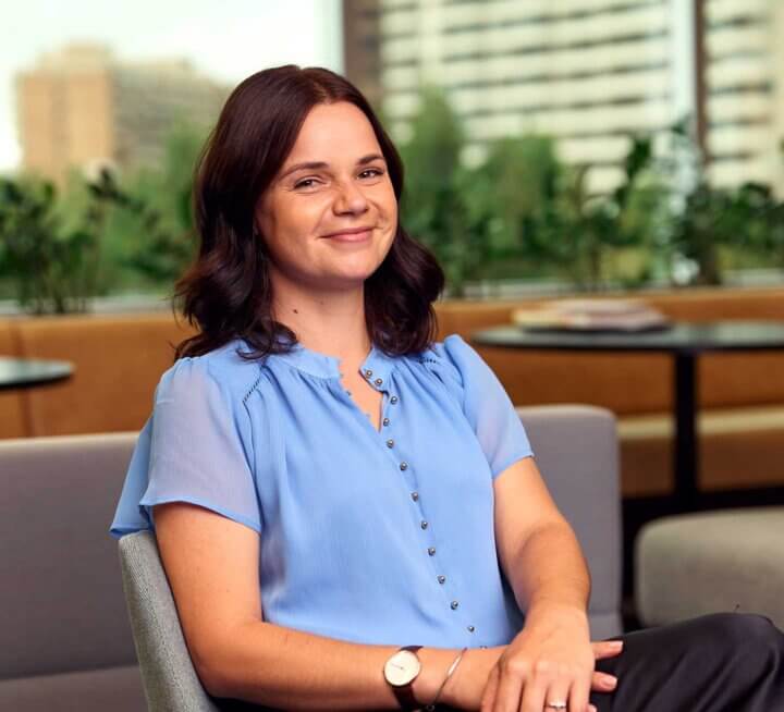 Female counselling and psychotherapy student Mahalia sitting at ACAP Sydney campus - close up profile shot