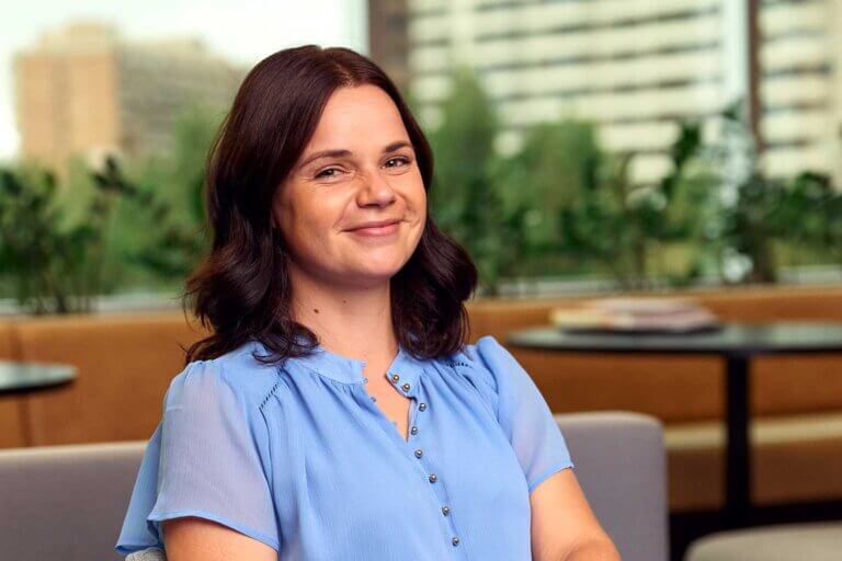 Female counselling and psychotherapy student Mahalia sitting at ACAP Sydney campus - close up profile shot