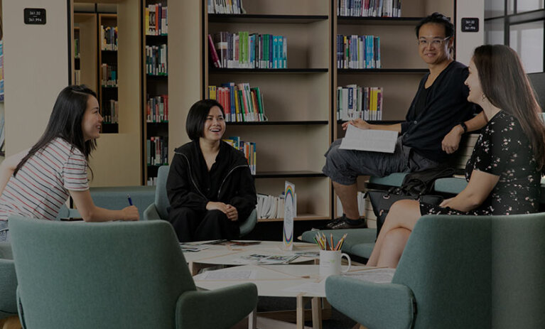 Calm-&-Conquer-header-image-mobile A group of students sitting in a group talking to each other at ACAP Sydney campus library - Calm & Conquer 828x676